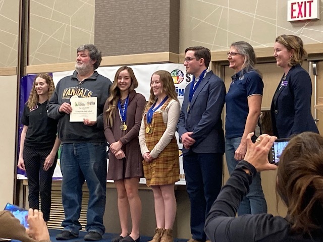 Students  accepting school award at the Idaho Science and Engineering Fair