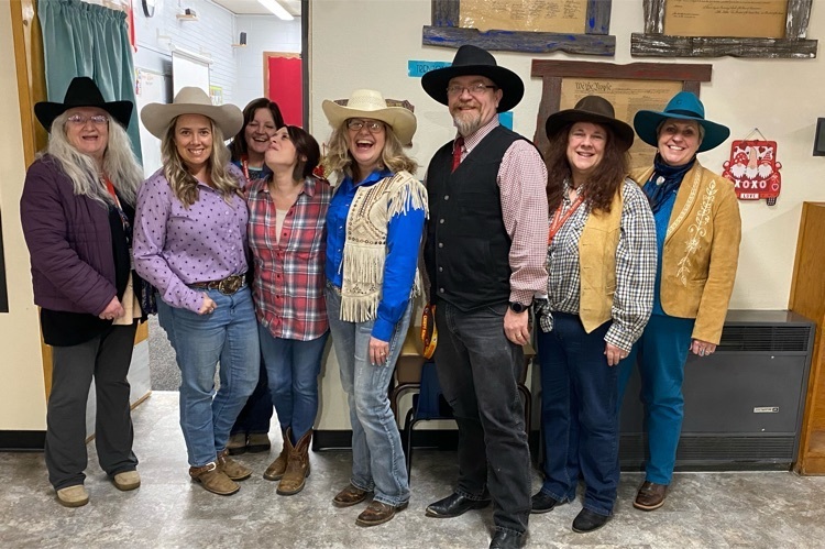 staff dressed in cowboy outfits 